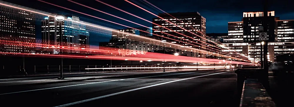Light trails along a city road at night
